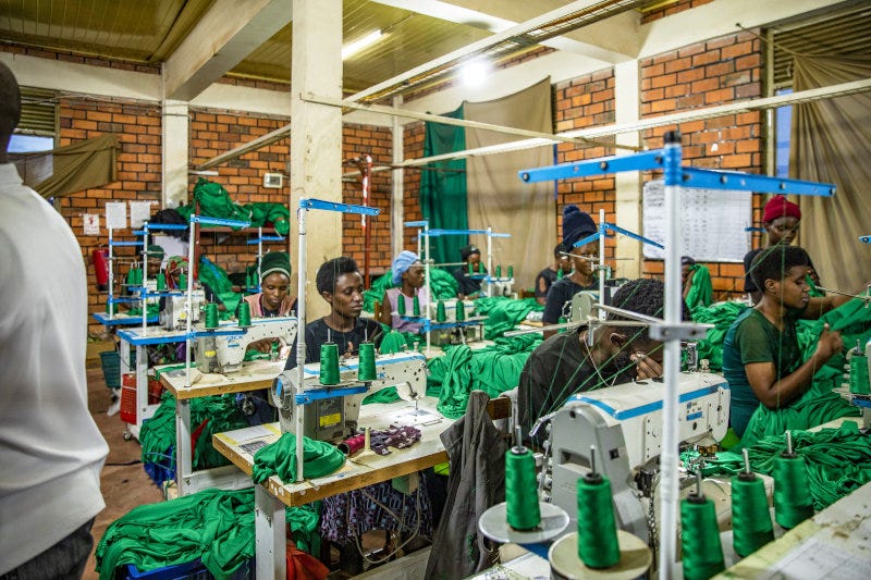Staff at work in the production room of New Kigali Designers and Outfitters in Kigali, Rwanda. Staff at work in the production room of New Kigali Designers and Outfitters in Kigali, Rwanda.