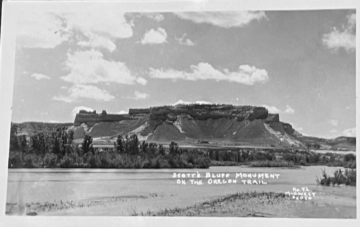 A black and white photo of a mountain

Description automatically generated