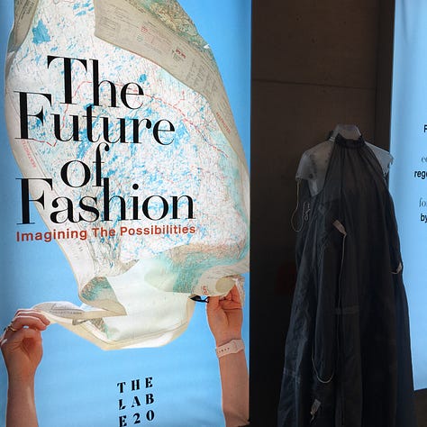 More photos from The Lab E20 exhibit — 1. A participatory board asking visitors to answer on post-it notes “What might you need from a supportive fashion community to continue to develop your fashion practice for earth and equity?”; 2. The Centre For Sustainable Fashion’s manifesto; 3. ‘The Future of Fashion: Imagining Possibilities’ exhibit entrance board with dress from Christopher Raeburn made from a reclaimed parachute.