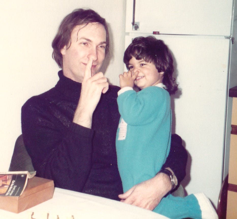 a father and daughter picking their noses