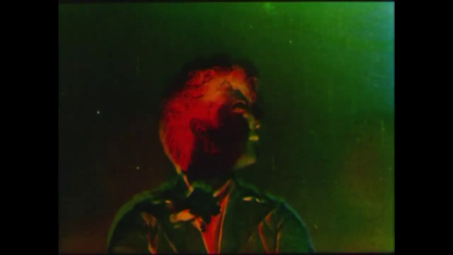 Woman's face in red, with murky green wash Woman's face in red, with murky green wash