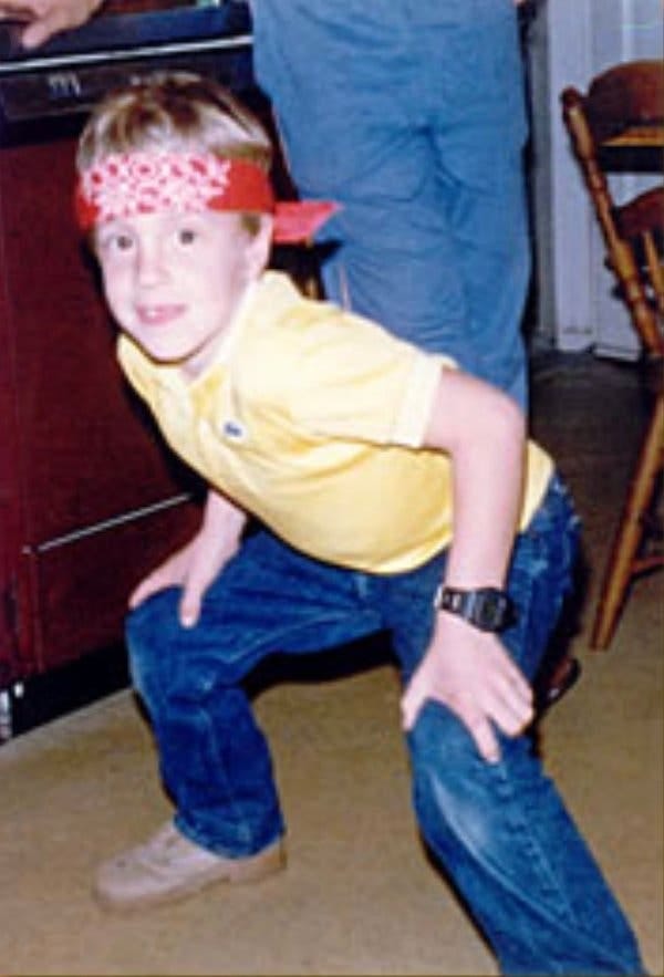 Welles Crowther, in a family photo, at age 8. His father gave him two handkerchiefs: a white pocket square and a utilitarian red one to blow his nose.