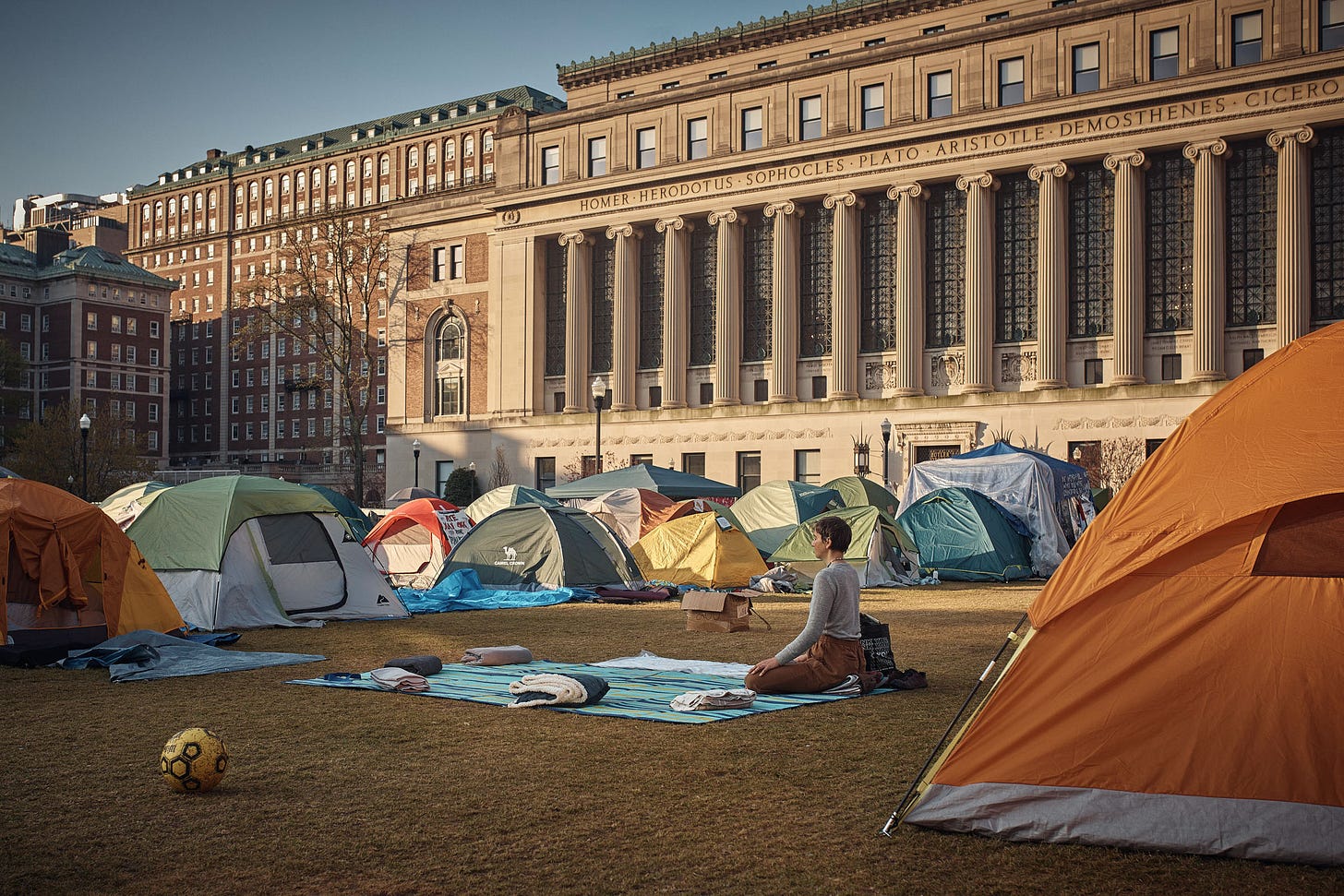 A protestor meditates early Monday morning inside the pro-Palestinian encampment on Columbia University campus in New York City on April 29. Andres Kudacki for TIME. A protestor meditates early Monday morning inside the pro-Palestinian encampment on Columbia University campus in New York City on April 29. Andres Kudacki for TIME.