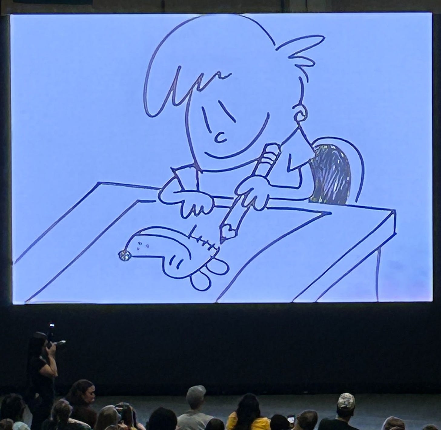 A group of people watching a drawing on a screen

AI-generated content may be incorrect.