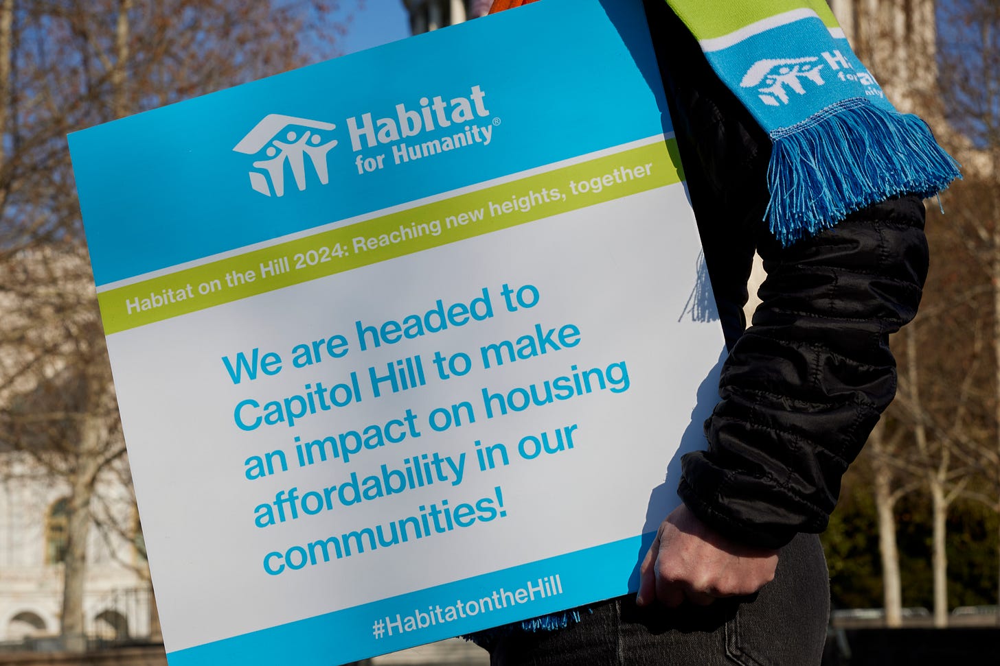 Sign that says "We are headed to Capitol Hill to make an impact on housing affordability in our communities". Sign that says "We are headed to Capitol Hill to make an impact on housing affordability in our communities".