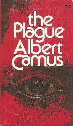 This may contain: the plague albert camus book is laying on the ground