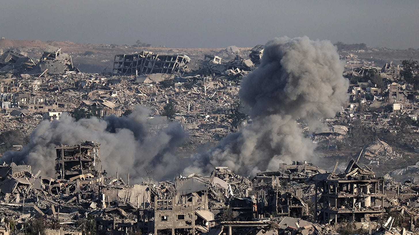 Smoke billows over destroyed buildings in Gaza during an Israeli strike, July 17, 2025. Jack Guez/AFP/Getty Images