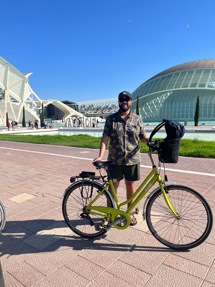Historic bridge (top left), bicycle in russafa neighborhood (top right), myself at the city of arts and science (bottom left), bicycle in front of shop (bottom right)