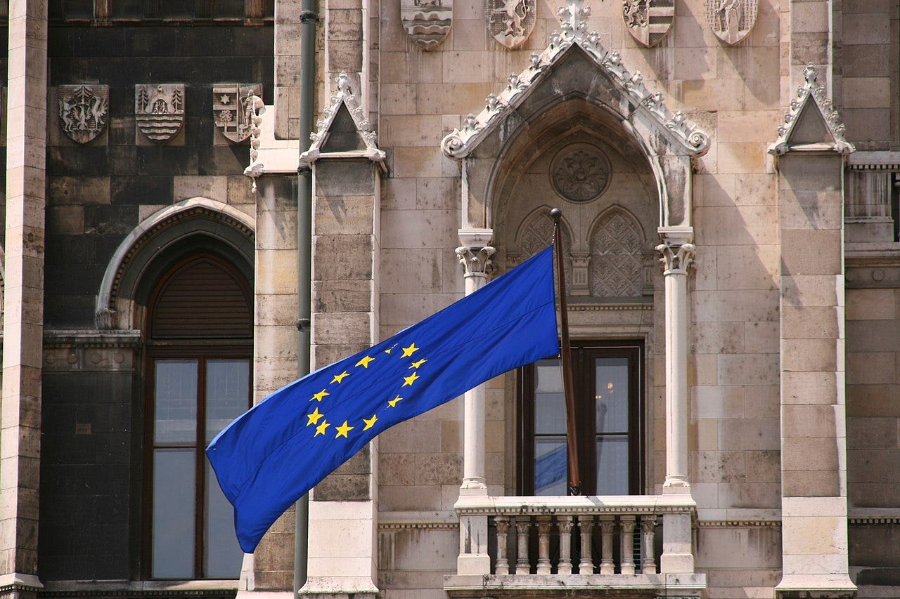 European Union flag on the balcony of the Hungarian Parliament building in Budapest European Union flag on the balcony of the Hungarian Parliament building in Budapest