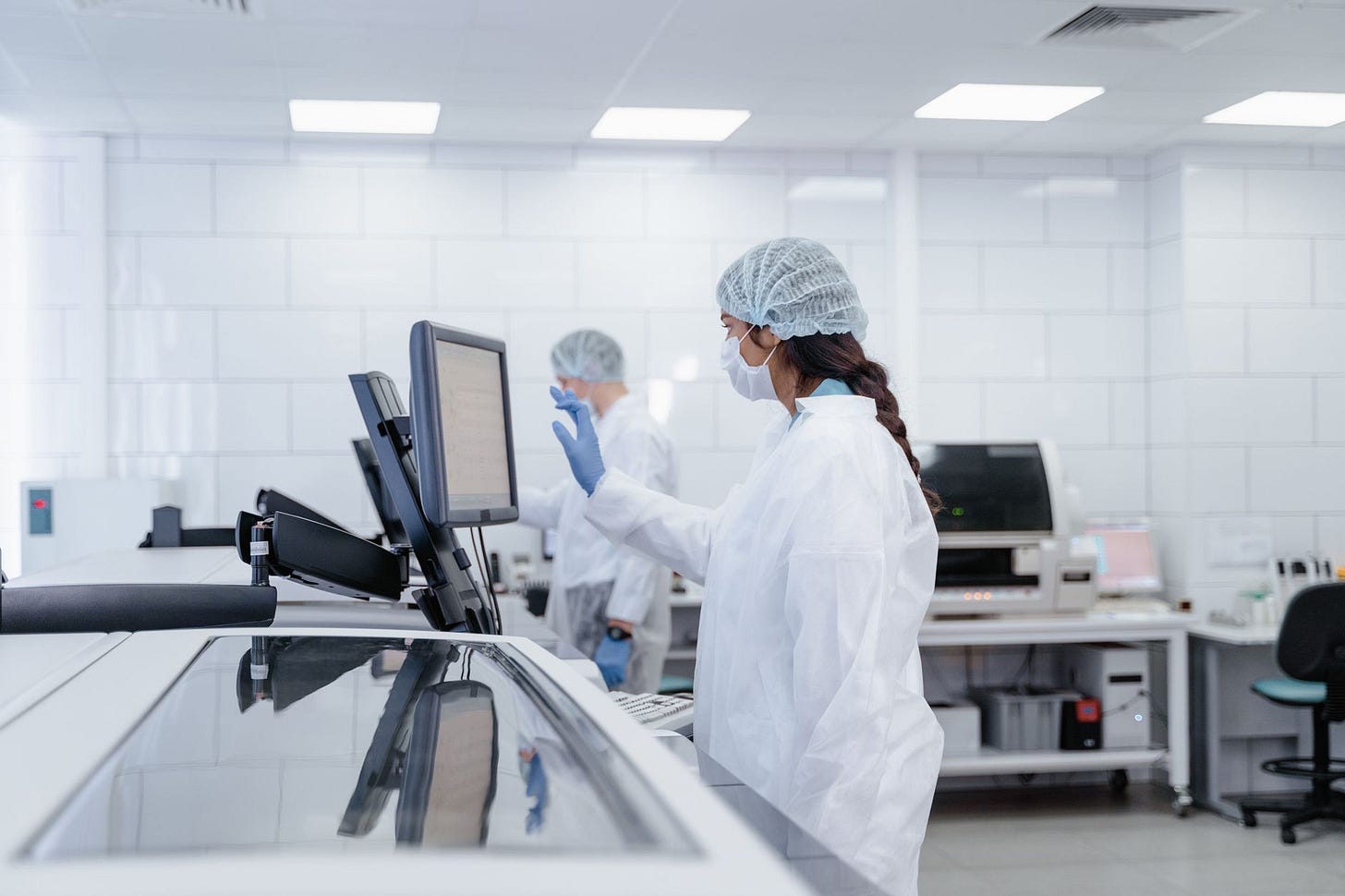 Photo by Tima Miroshnichenko on Pexels Scientist in protective gear operates equipment in a modern lab. (stock photo)