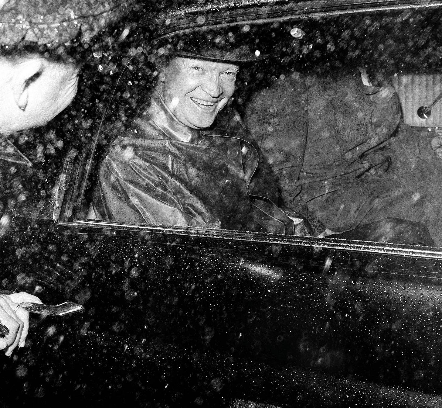 President Dwight Eisenhower smiles upon arrival at Moody Air Force Base, Georgia, February 4, 1959, embarking on a vacation for quail shooting and golf despite the rainy forecast. President Dwight Eisenhower smiles upon arrival at Moody Air Force Base, Georgia, February 4, 1959, embarking on a vacation for quail shooting and golf despite the rainy forecast.