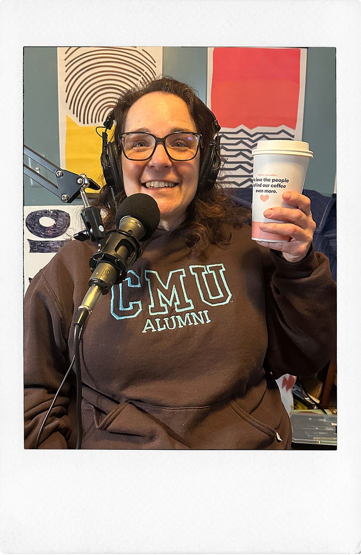 Two photos: One of Joanna, a gorgeous brunette wearing a CMU Alumni sweatshirt and holding up a coffee - next to a microphone. The other photo is of Sara K behind a microphone wearing a barf green knit hat and headphones with a cat in them, laughing about smething