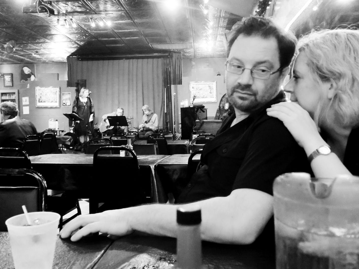 A person and person sitting at a table

Description automatically generated