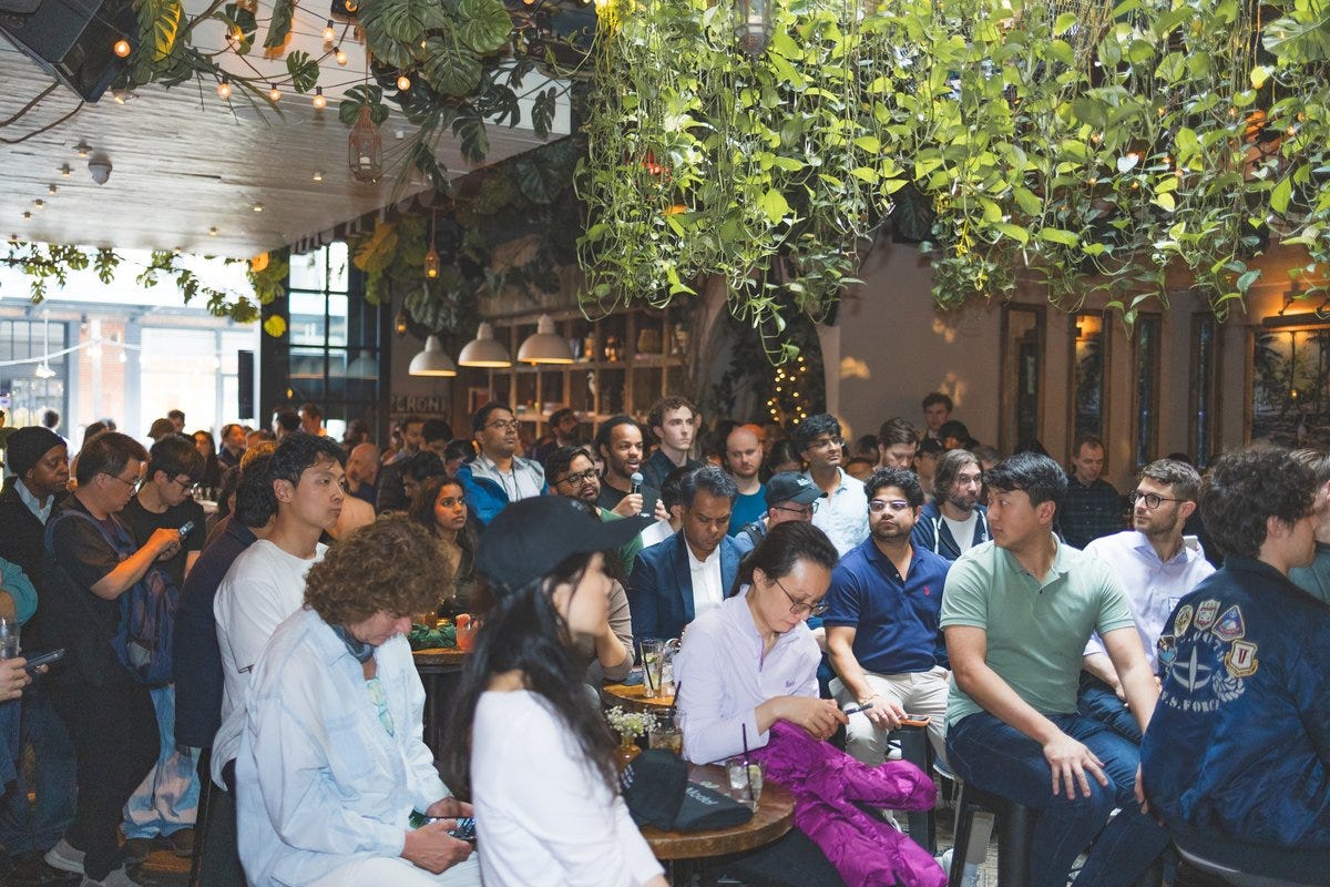 Packed audience watching a presentation