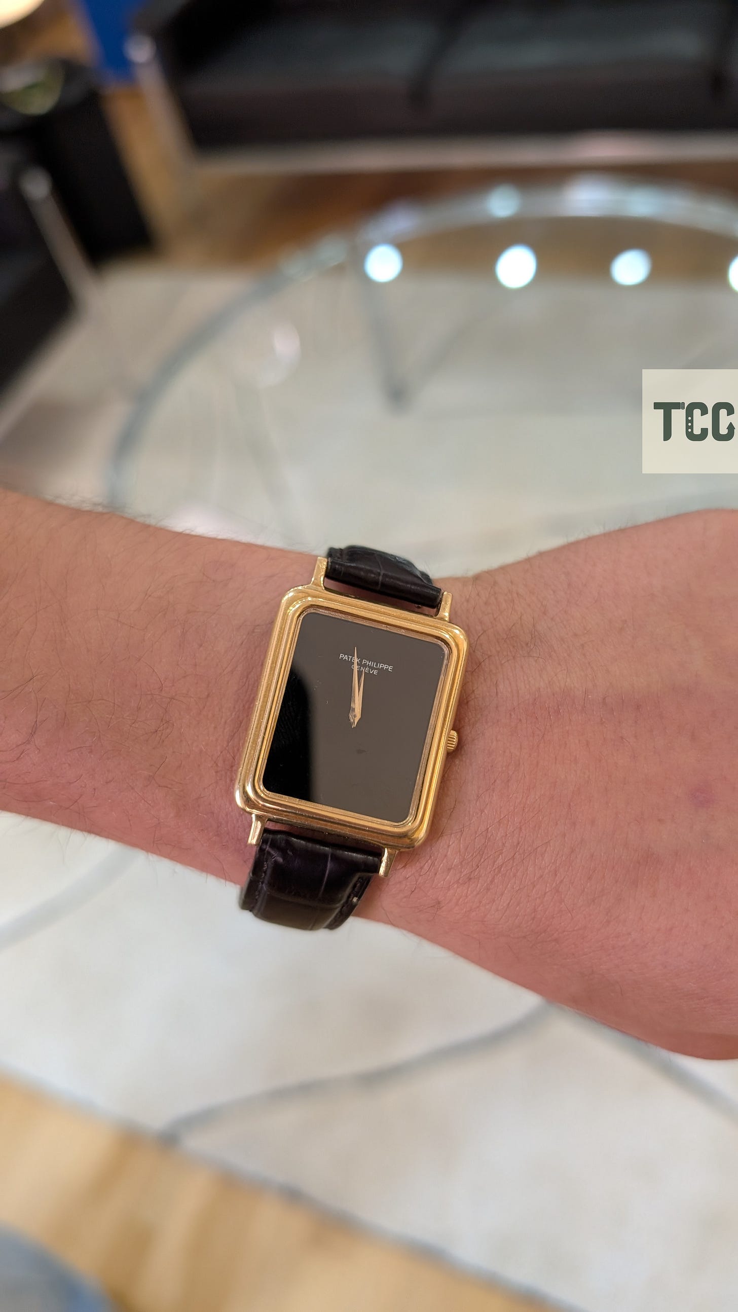 A vintage watch on the wrist of a man.