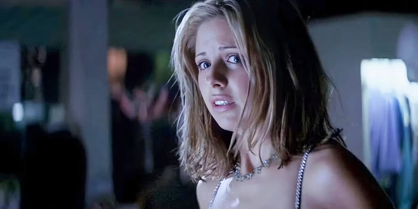 young sarah michelle gellar in a strappy top with cropped hair looking terrified young sarah michelle gellar in a strappy top with cropped hair looking terrified