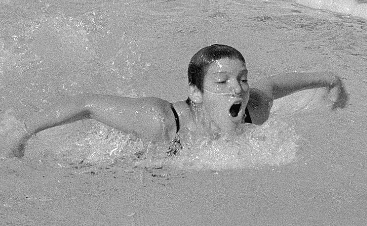 A person swimming in a pool
Description automatically generated A person swimming in a pool
Description automatically generated