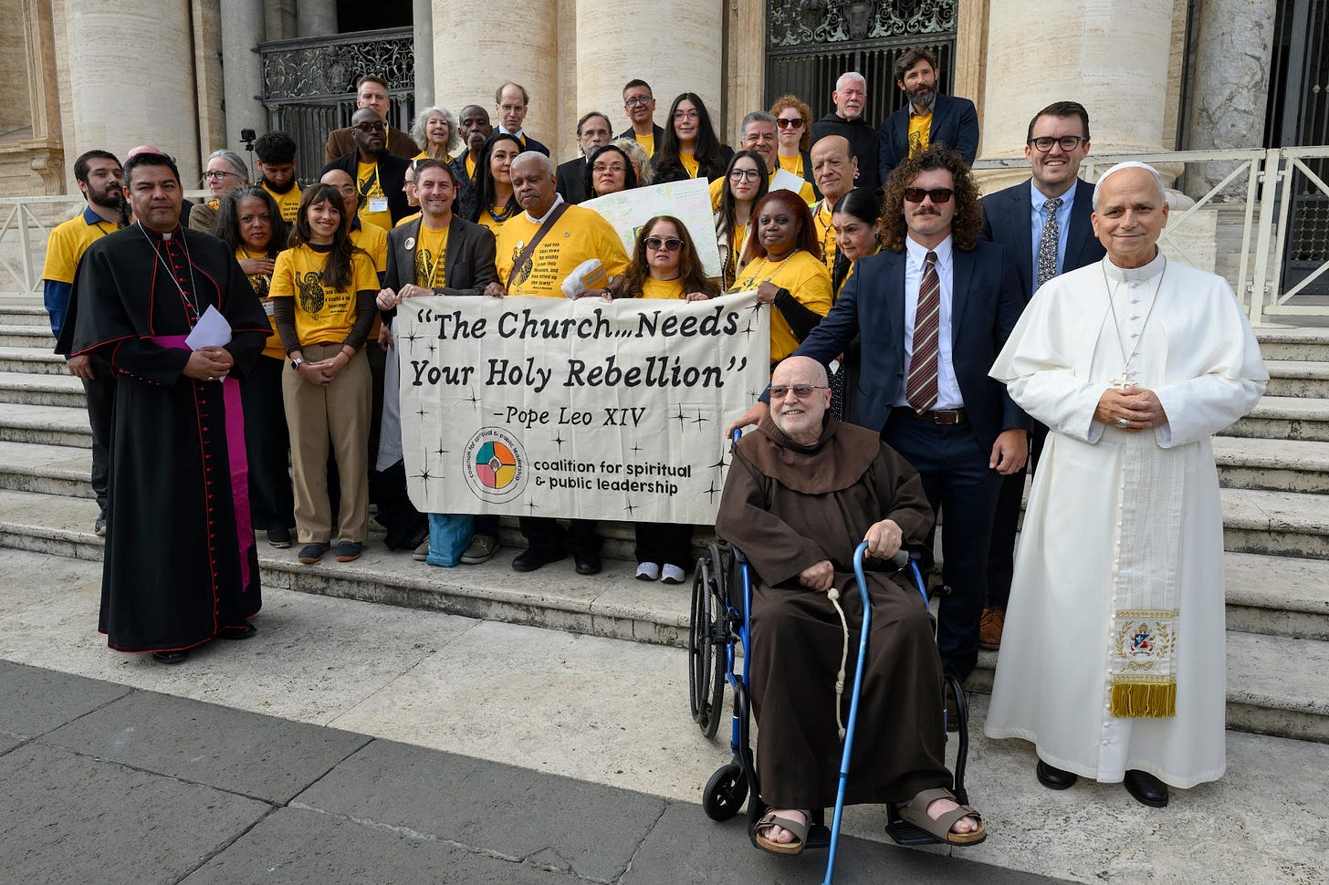 Pope Leo XIV with the Chicago delegation and its Holy Rebellion banner on the steps of St. Peter’s Pope Leo XIV with the Chicago delegation and its Holy Rebellion banner on the steps of St. Peter’s