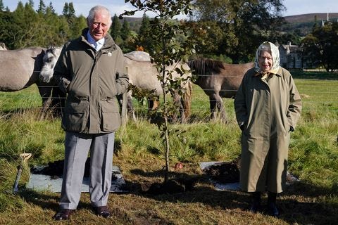 britain's queen elizabeth ii and britain's prince charles, prince of wales pose alongside the tree which they planted to mark the start of the official planting season for the queen's green canopy britain's queen elizabeth ii and britain's prince charles, prince of wales pose alongside the tree which they planted to mark the start of the official planting season for the queen's green canopy