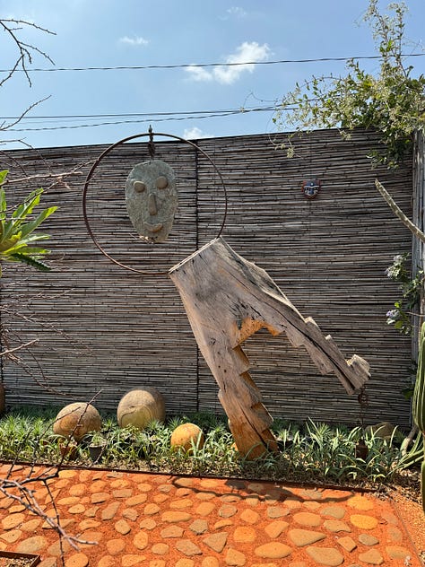 Nine images of sculpture placed within the cactus garden Vives Verde.