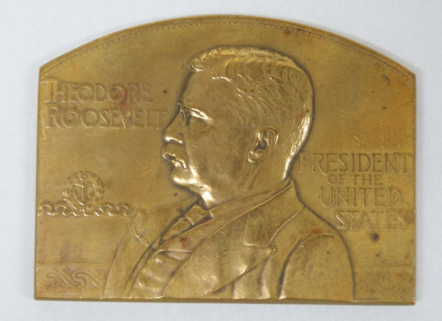 A close-up of a gold coin

Description automatically generated