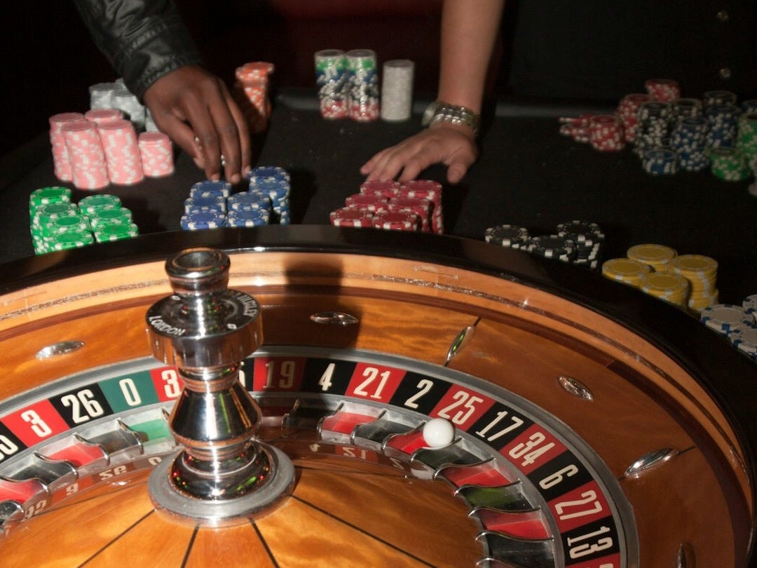 stainless steel round table on brown wooden table