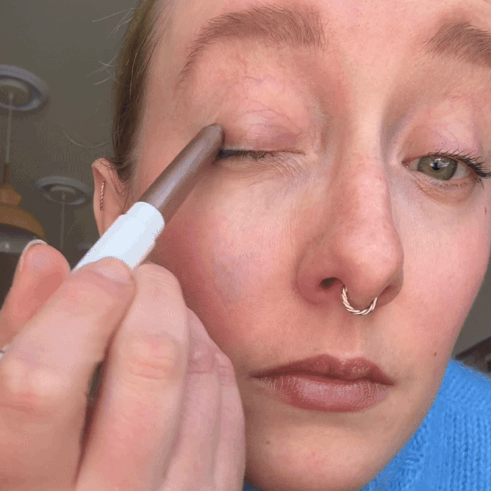 applying the ilia eye stylus shadow stick in shade regal