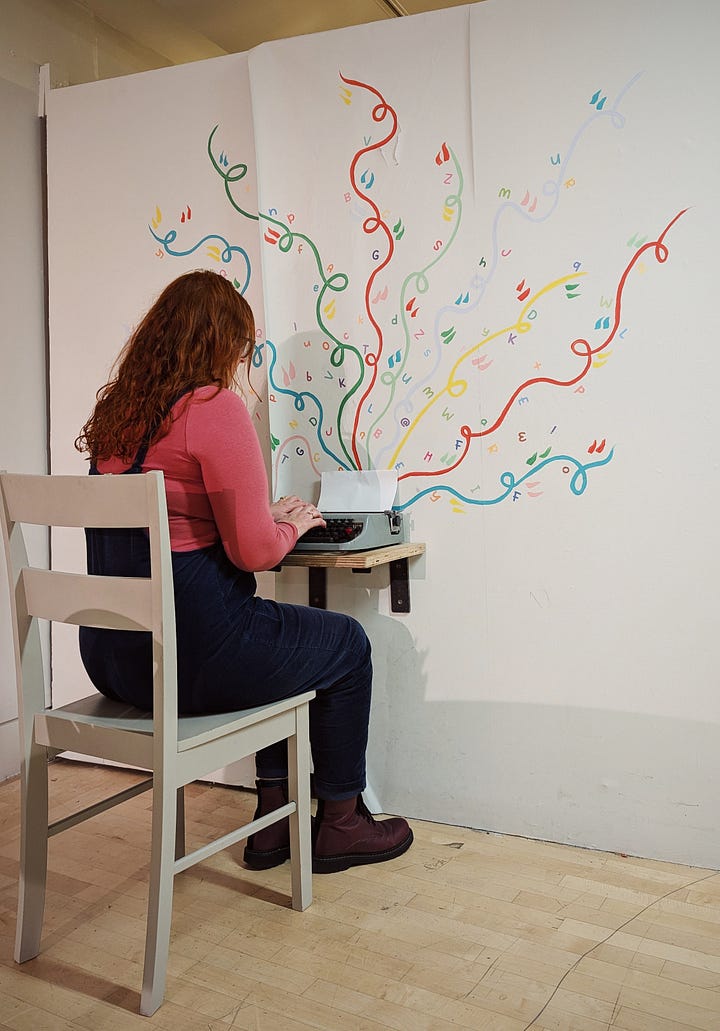 Image 1 shows a woman with long, wavy red hair, navy dungarees and a rose-pink, long-seleeve top, and purple boots, sitting at a desk. She is motioning at a typwriter with a blank page, spirals of coloured lines curling up across the white wall behind the desk. Image two shows a bright, inviting children's book shop, strung with fairy lights, with large wooden tables and chairs.