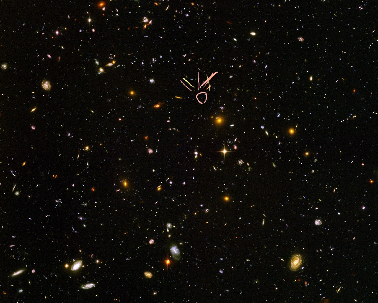 photo of colourful galaxies in deep space taken from a telescope