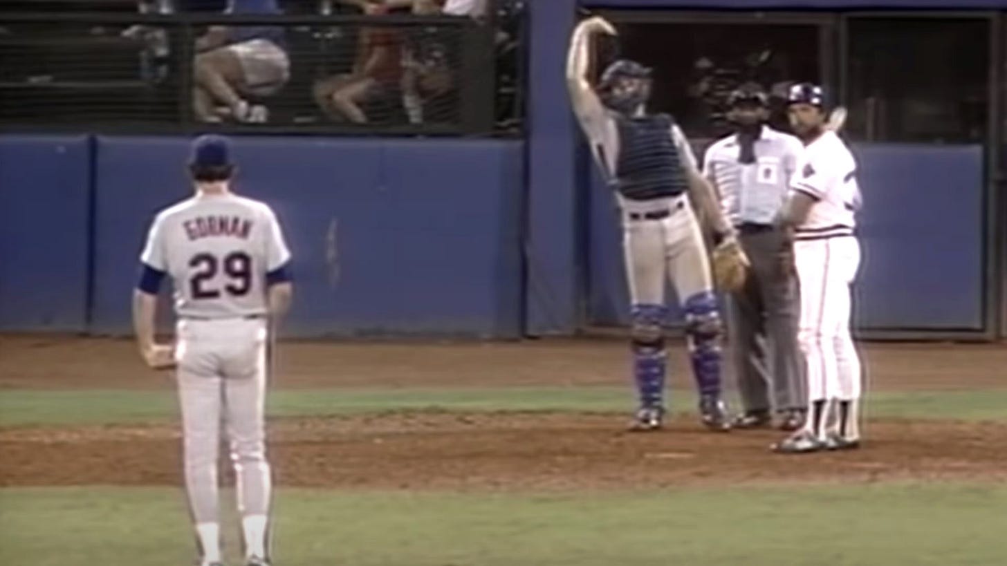 Gary Carter waves the Mets outfielders in with the light-hitting Camp at bat. Gary Carter waves the Mets outfielders in with the light-hitting Camp at bat.