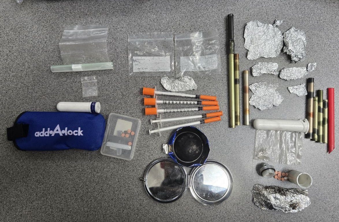 May be an image of tool bag, lighter and text May be an image of tool bag, lighter and text