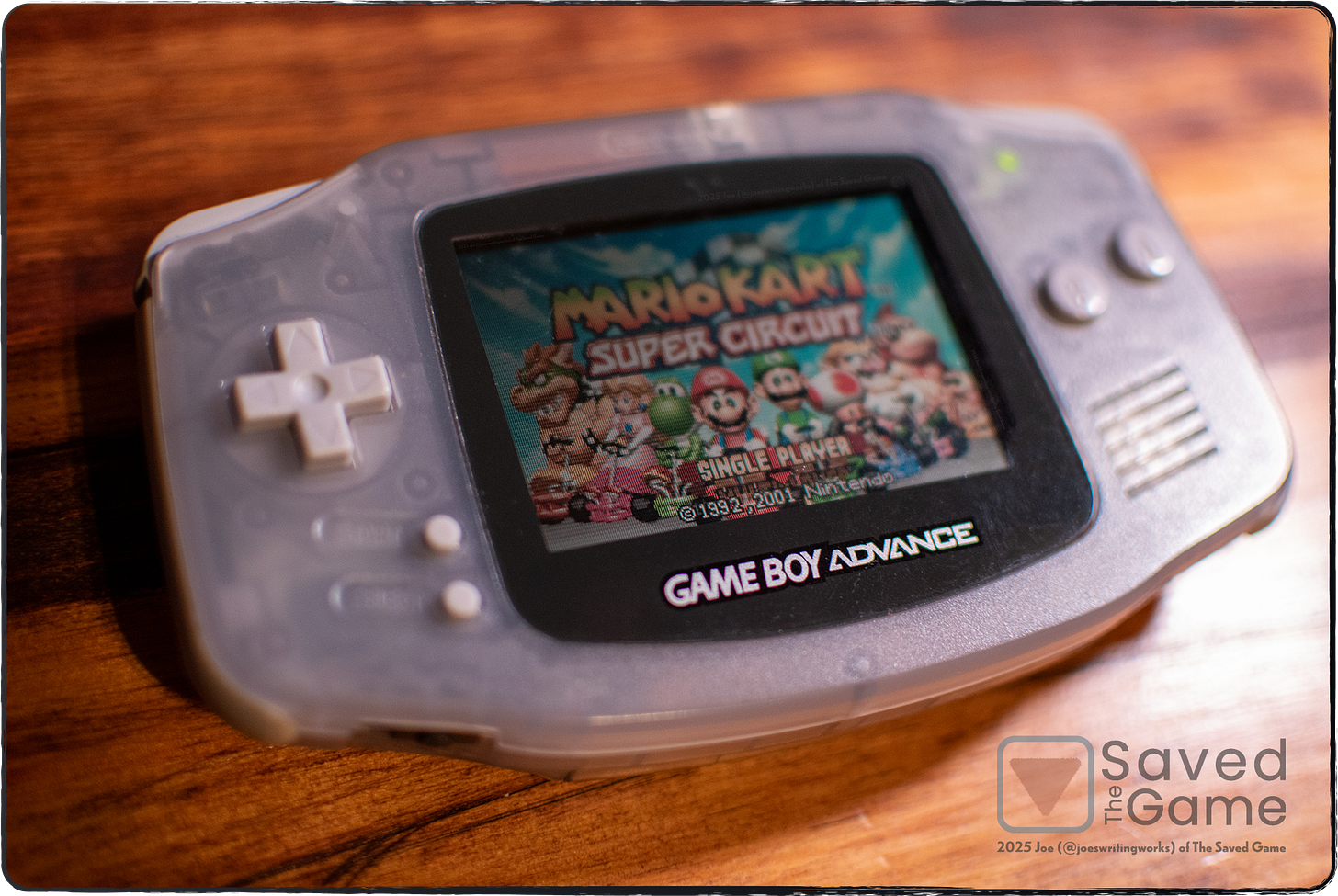 An image showing a game boy advance, playing mario kart super circuit!