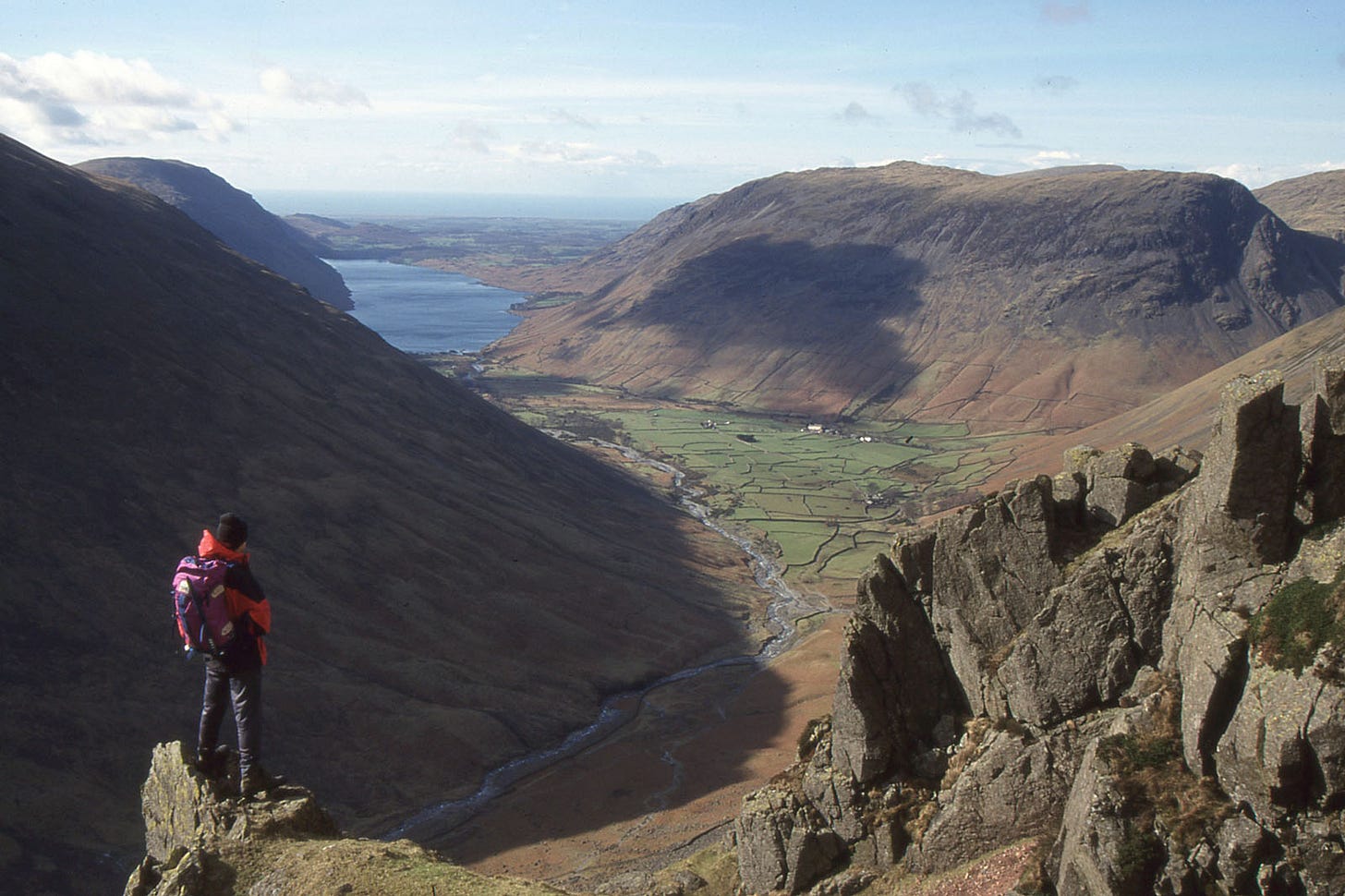 walker (me) looking down on distant lake (Wastwater)