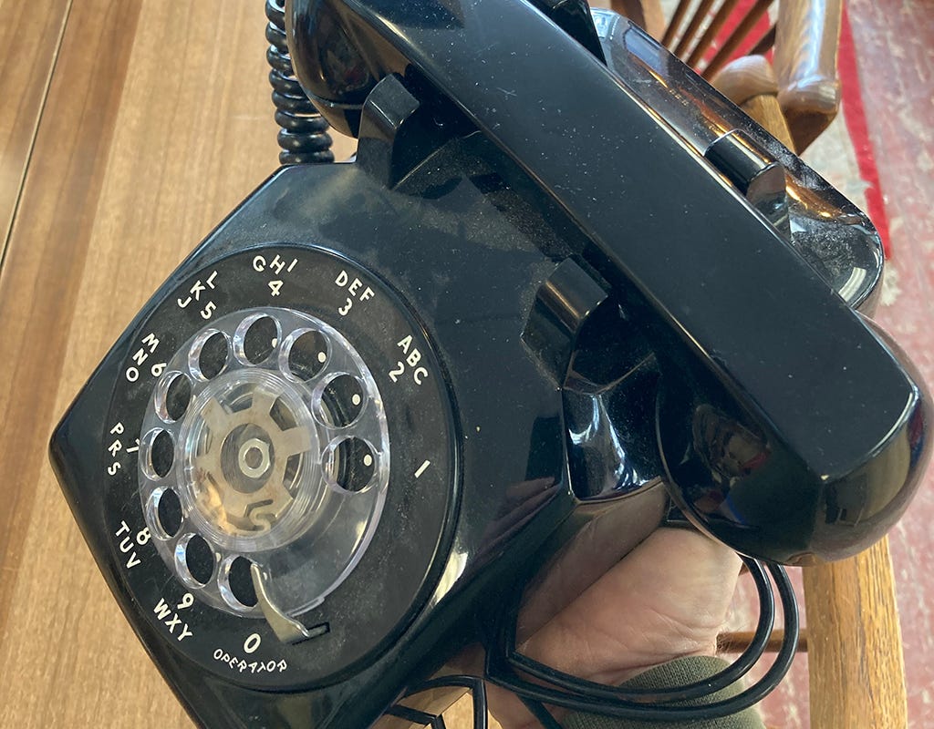 Photo of an old rotary dial telephone