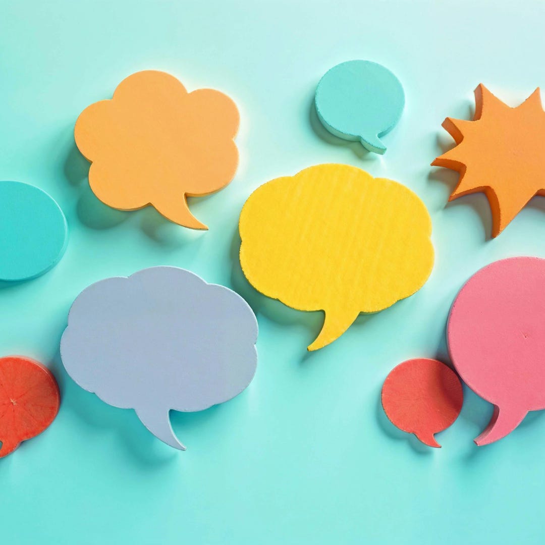 Colorful Speech Bubbles on Turquoise Background Colorful Speech Bubbles on Turquoise Background