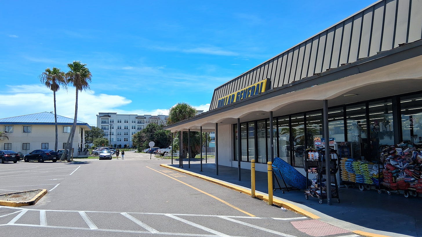 High-end luxury meets everyday reality. The Tides structure peeking over the neighborhood Dollar General.