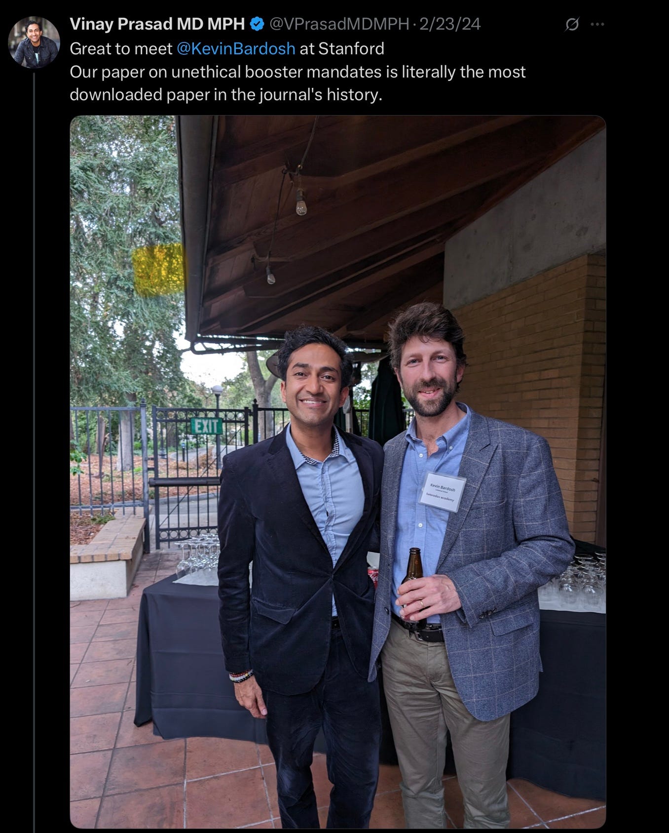 Vinay Prasad tweet from 2/23/24 with a picture of them together at Stanford. Prasad boasts that “our paper on unethical booster mandates is literally the most downloaded paper in the journal’s history.”