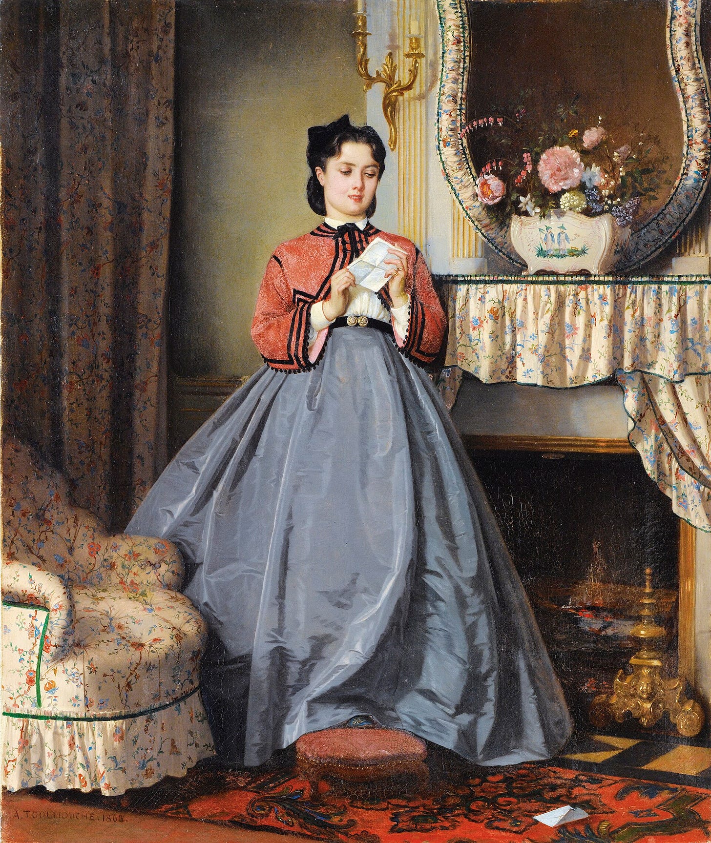 Woman reading letter by fireplace Woman reading letter by fireplace
