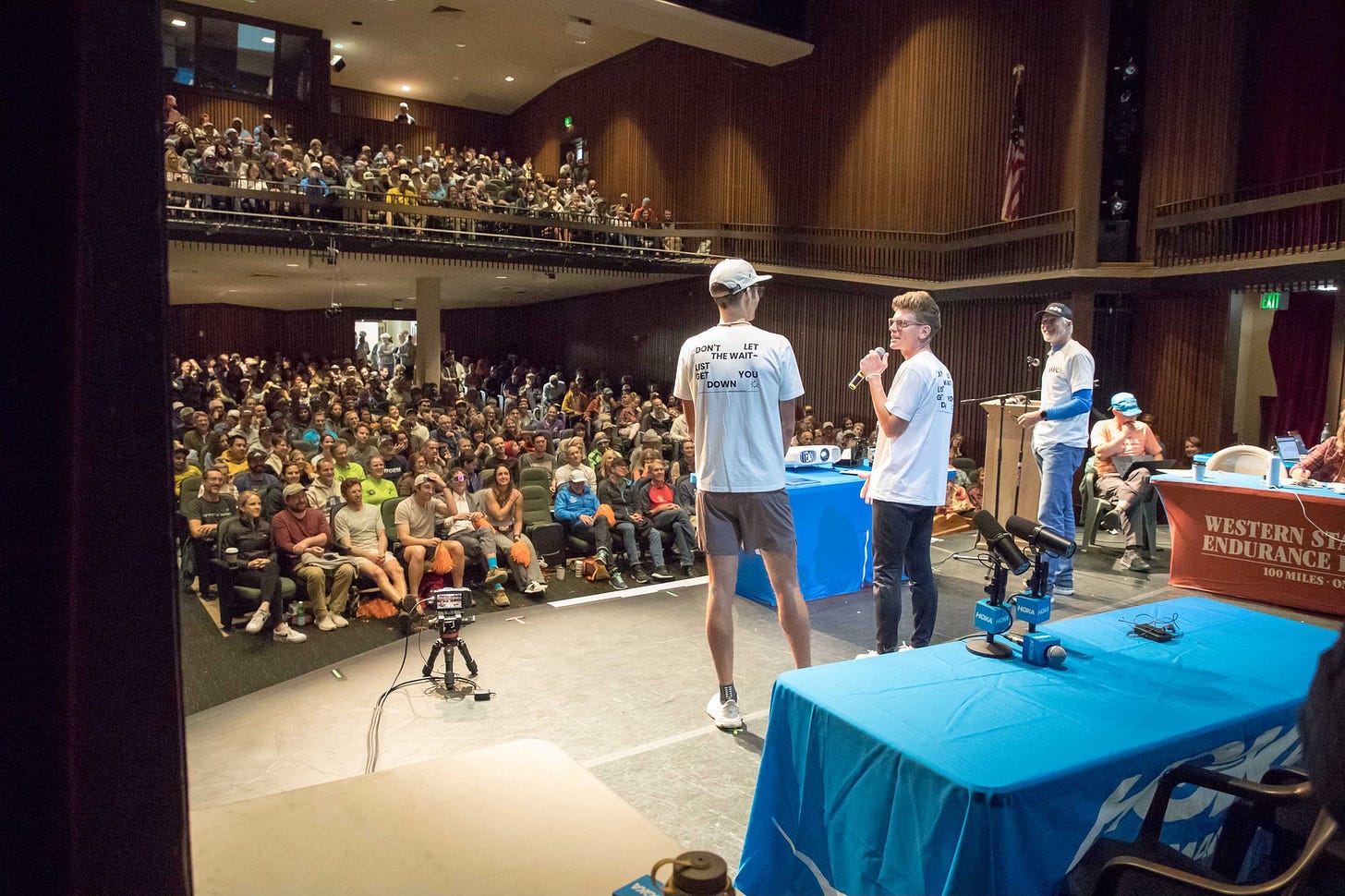 A big hall where the western states lottery is taking place in front of a live audience