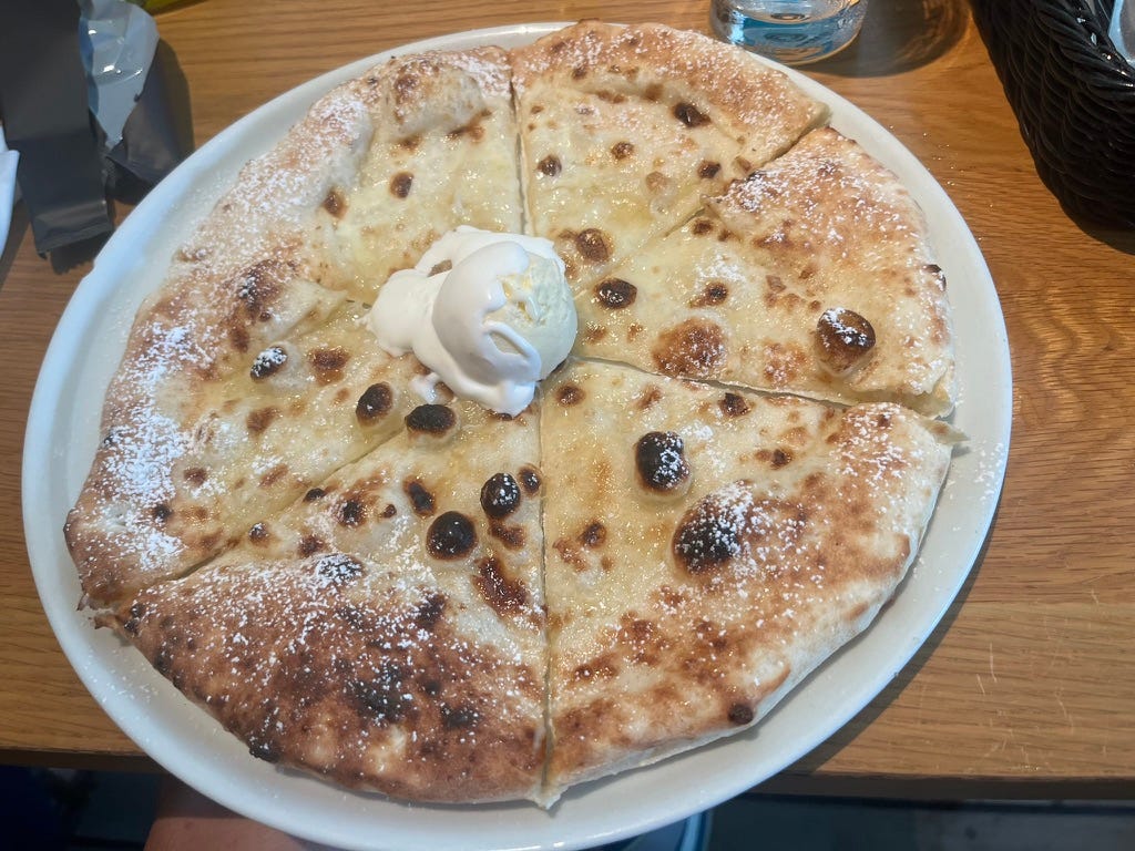 A white pizza with vanilla ice cream in the middle A white pizza with vanilla ice cream in the middle