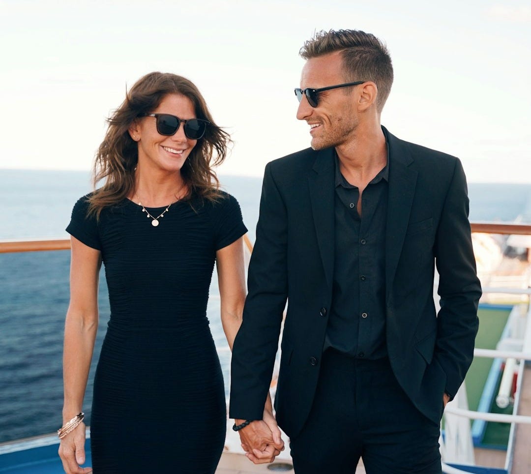 a man and woman wearing sunglasses and standing on a deck a man and woman wearing sunglasses and standing on a deck