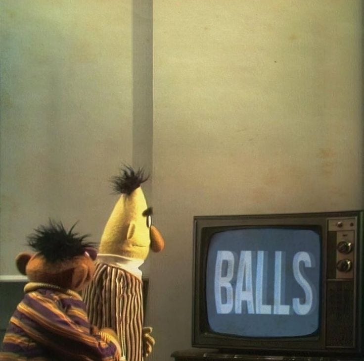 This may contain: two puppets are standing in front of a television