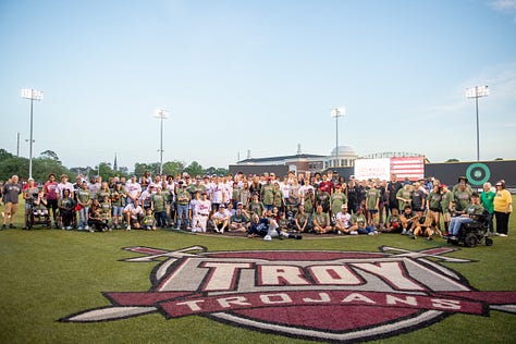 TROY student-athletes help celebrate opening night of the Miracle League with Miracle League players on Monday night at Riddle-Pace field. The Troy Miracle League in Troy, Alabama, provides children and adults of all ages with disabilities the opportunity to play baseball, and have fun. (Photos/Joey Meredith)