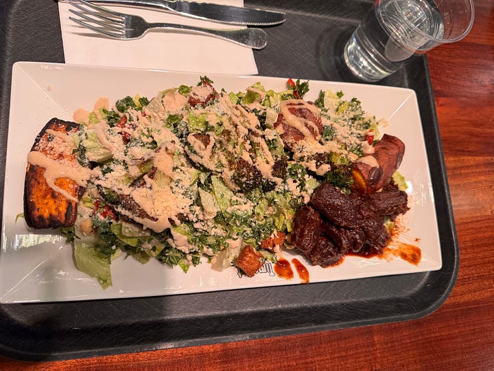 photos of promotional postcard for winter food specials; Asian nori tacos; a large vegan Caesar salad plate; and a hamburger