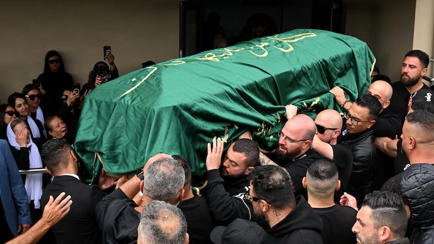 Pallbearers carry a coffin Pallbearers carry a coffin