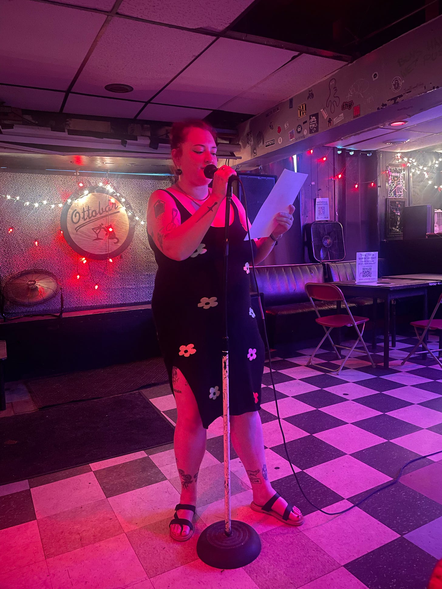 nat introduces a featured reader at FRUITCAKE nat introduces a featured reader at FRUITCAKE