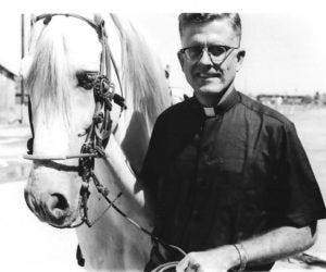 Father Thomas pictured with the peacemaking horse, Amen.