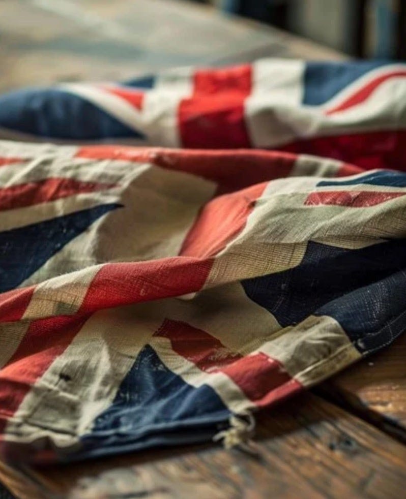A Union Jack flag lying crumpled on an oak table.