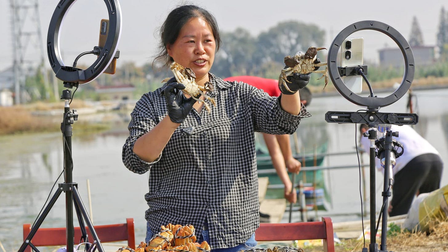 HAIAN, CHINA - NOVEMBER 7, 2023 - A crab farmer sells crabs via a live webcast at Xinhai village in Haian city, Jiangsu province, China, Nov 7, 2023. (Photo by Costfoto/NurPhoto via Getty Images)