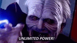 a man in a star wars mask is holding a blue light and says `` unlimited power ! '' a man in a star wars mask is holding a blue light and says `` unlimited power ! ''